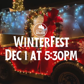 Zamboni decorated for Christmas with Walker Winterfest in white lettering