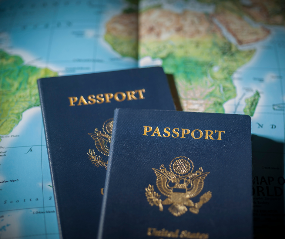 Two passports against a world map