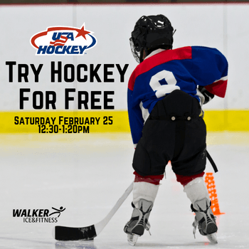 Boy playing with hockey stick and puck on ice