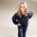 woman standing in front of a wall