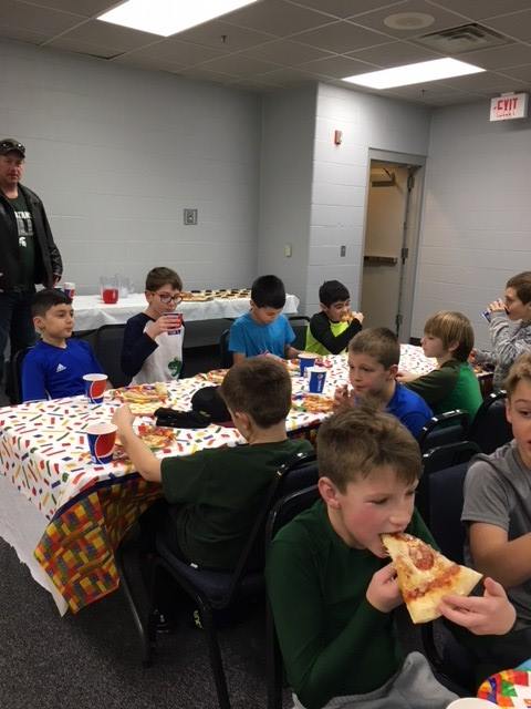 Kids eating pizza at a party